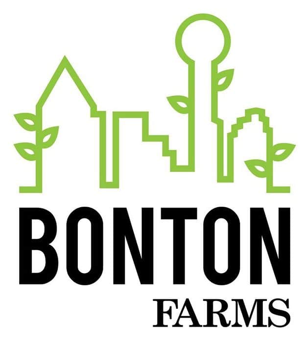 Logo of Bonton Farms featuring a green city skyline with leaves sprouting from buildings and the text "Bonton Farms" below.